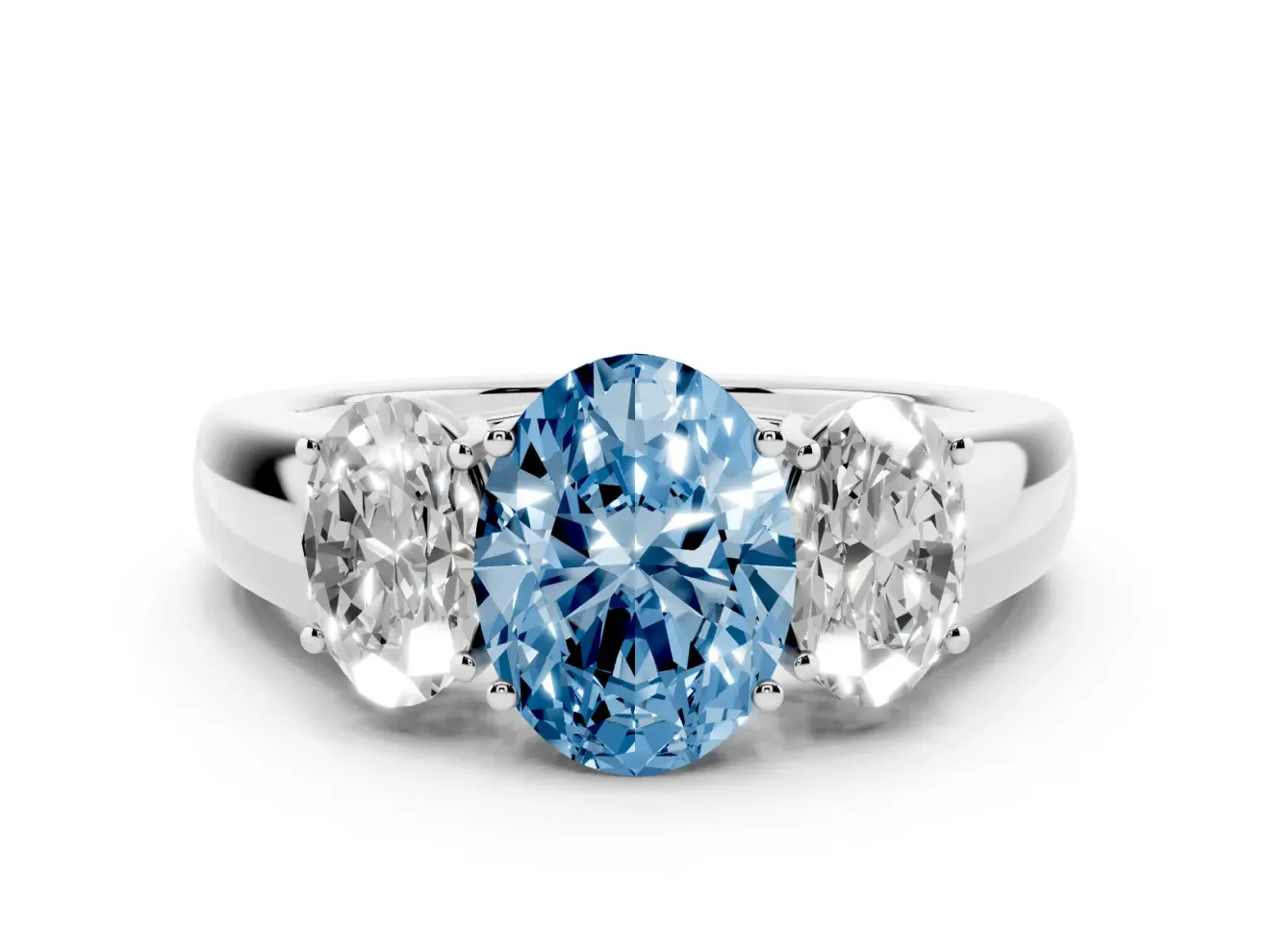 Fancy Blue Three-Stone Oval Cut Diamond Ring Set in Silver with Matching Prong Settings and Plain Band