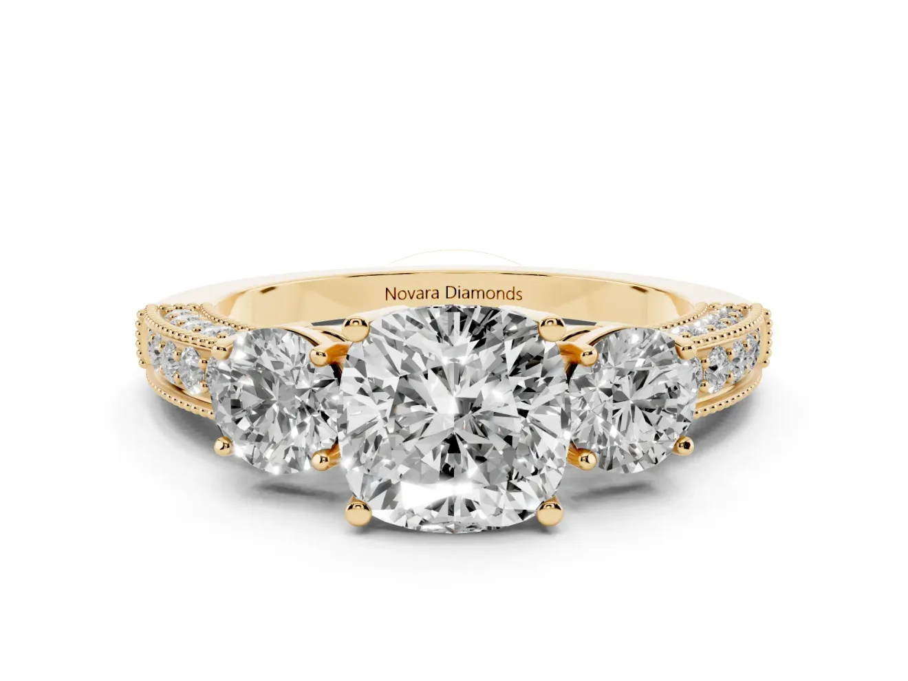 Cushion Cut Diamond Three-Stone Ring Set in Yellow gold with Round Side Stones and Pavé Band