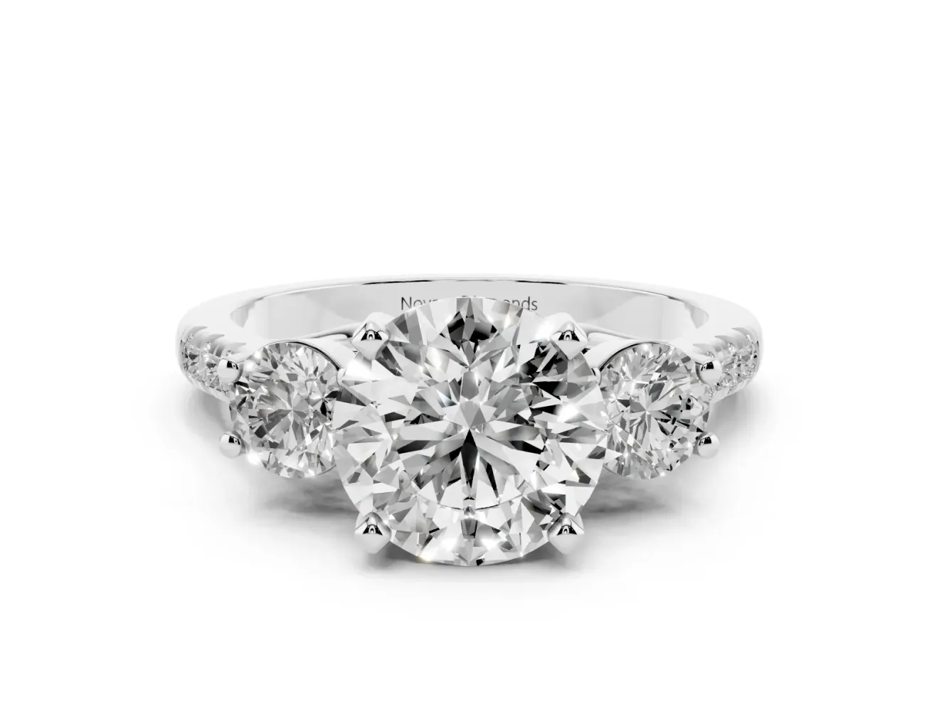 Three-Stone Round Cut Diamond Pavé Band Ring Set in Platinum with Prong-Set Trio