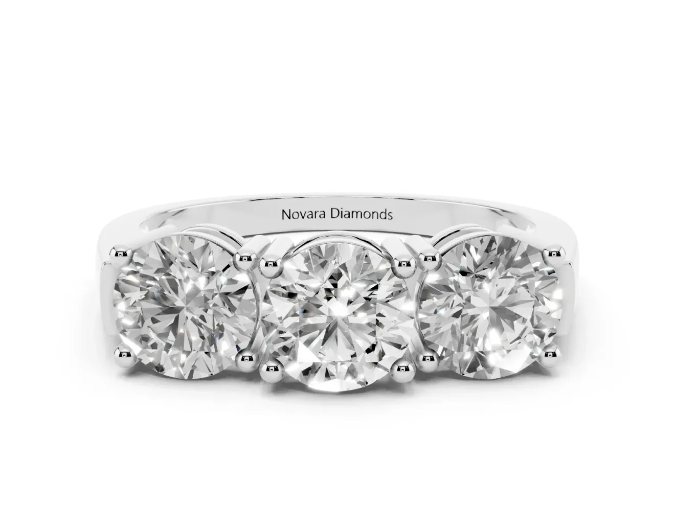 Round Cut Diamond Three-Stone Ring Set in White gold with Channel Band and Sturdy Prongs