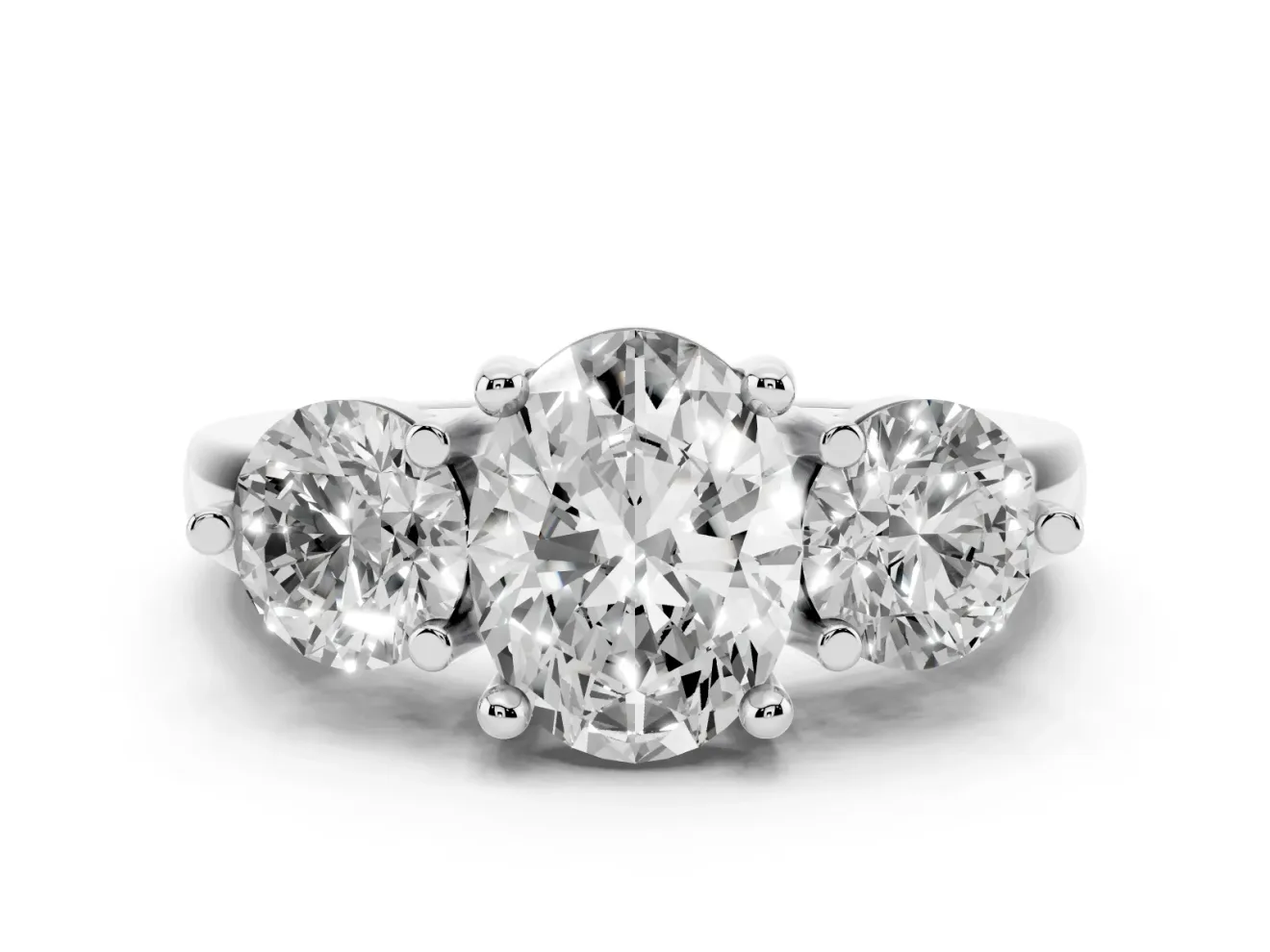 Oval Cut Diamond Three-Stone Ring Set in White gold with Prong Setting and Classic Band