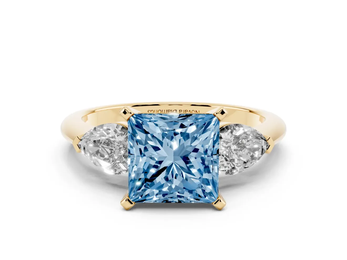 Fancy Blue Three-Stone Princess Cut Diamond Ring Set in Yellow gold with Pear Side Stones and Prong Setting