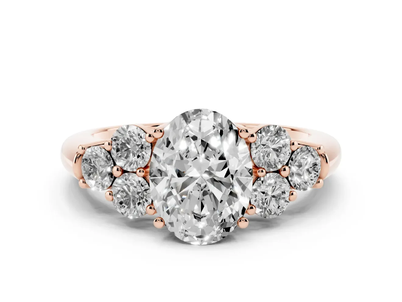 Oval Cut Diamond Cluster Ring Set in Rose gold with Round Accent Stones and Prong Setting on a Plain Band