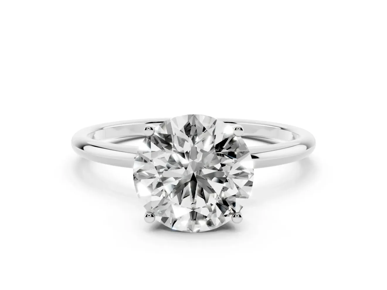 Round Cut Diamond Solitaire Engagement Ring Set in White gold with Thin Band and Prong Setting