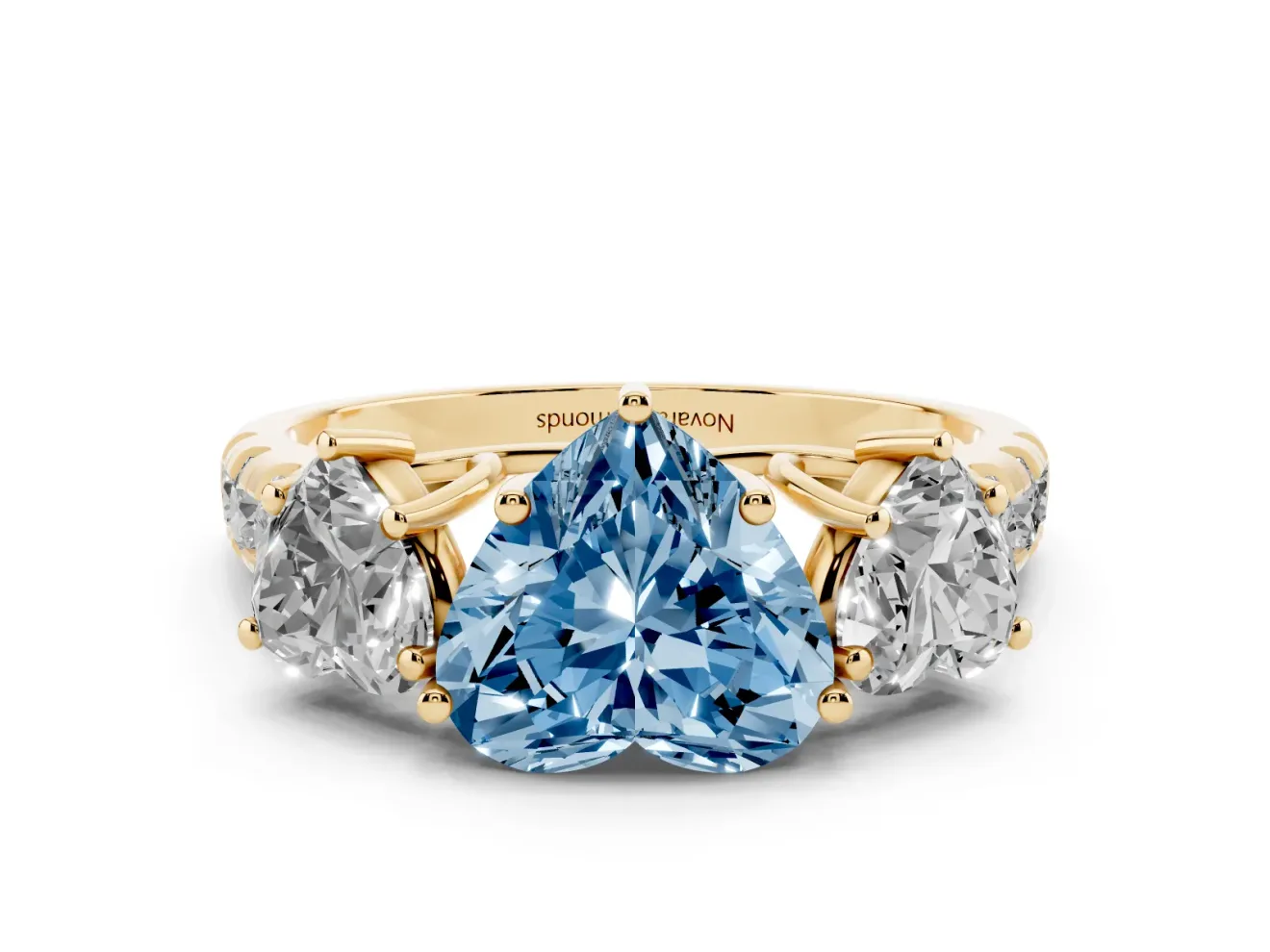Fancy Blue Heart Cut Diamond Three-Stone Ring Set in Yellow gold with Pavé Band