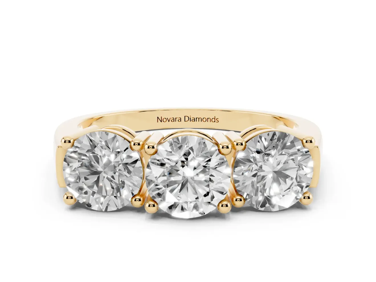 Round Cut Diamond Three-Stone Ring Set in Yellow gold with Channel Band and Sturdy Prongs