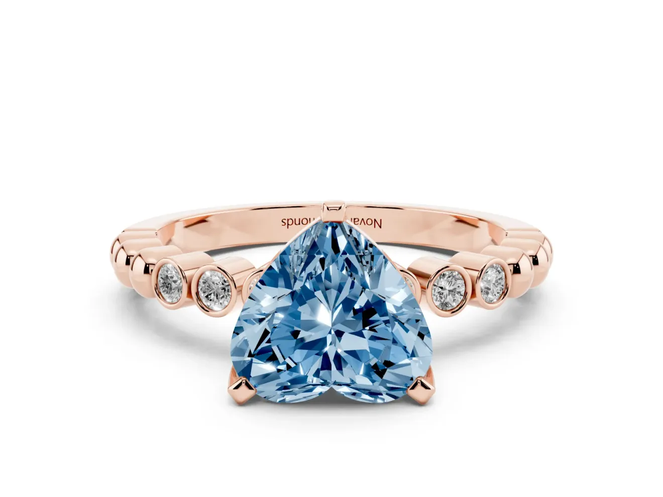 Fancy Blue Heart Cut Diamond Solitaire Engagement Ring Set in Rose gold with Bezel Accents on Beaded Band