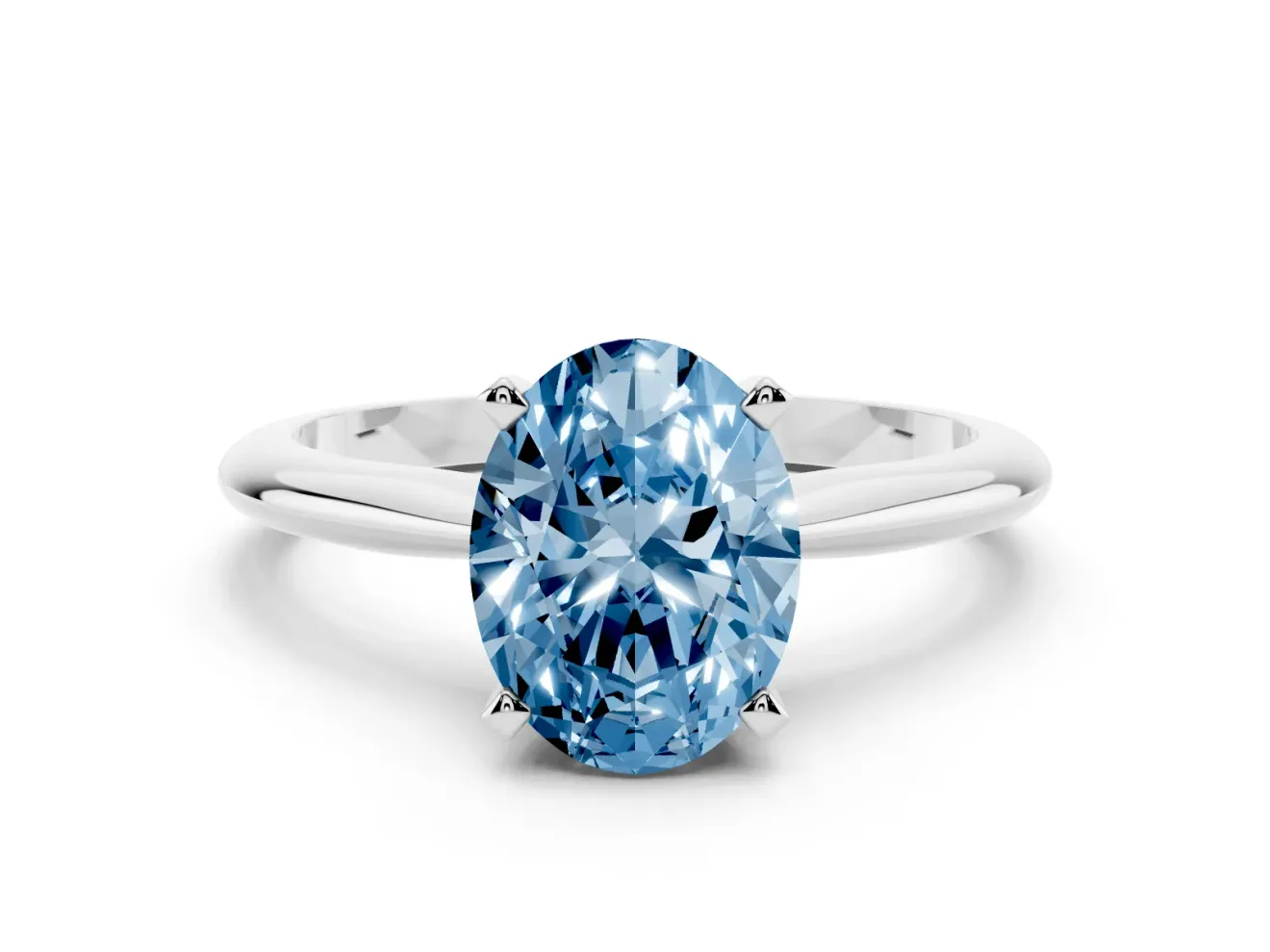 Fancy Blue Oval Cut Diamond Solitaire Ring Set in Silver with Prong Setting on a Plain Round Band