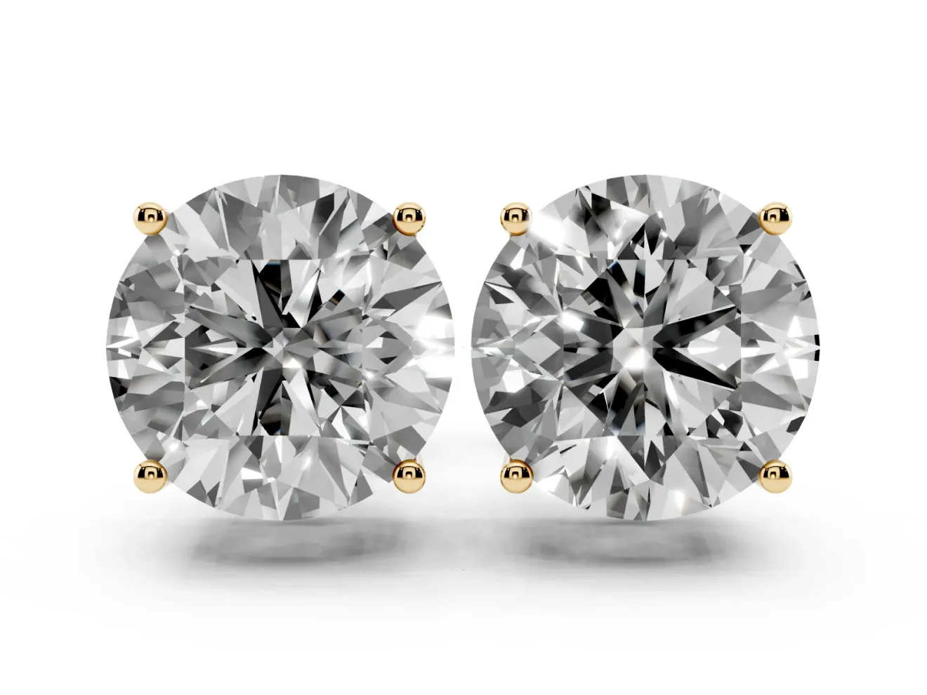 Round Cut Diamond Solitaire Stud Earrings Set in Yellow gold with Basket Setting