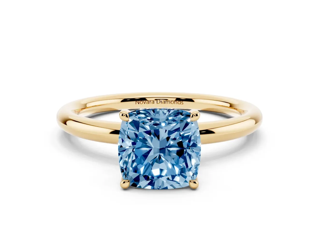 Fancy Blue Cushion Cut Diamond Solitaire Ring Set in Yellow gold with Thin Band and Prong Setting