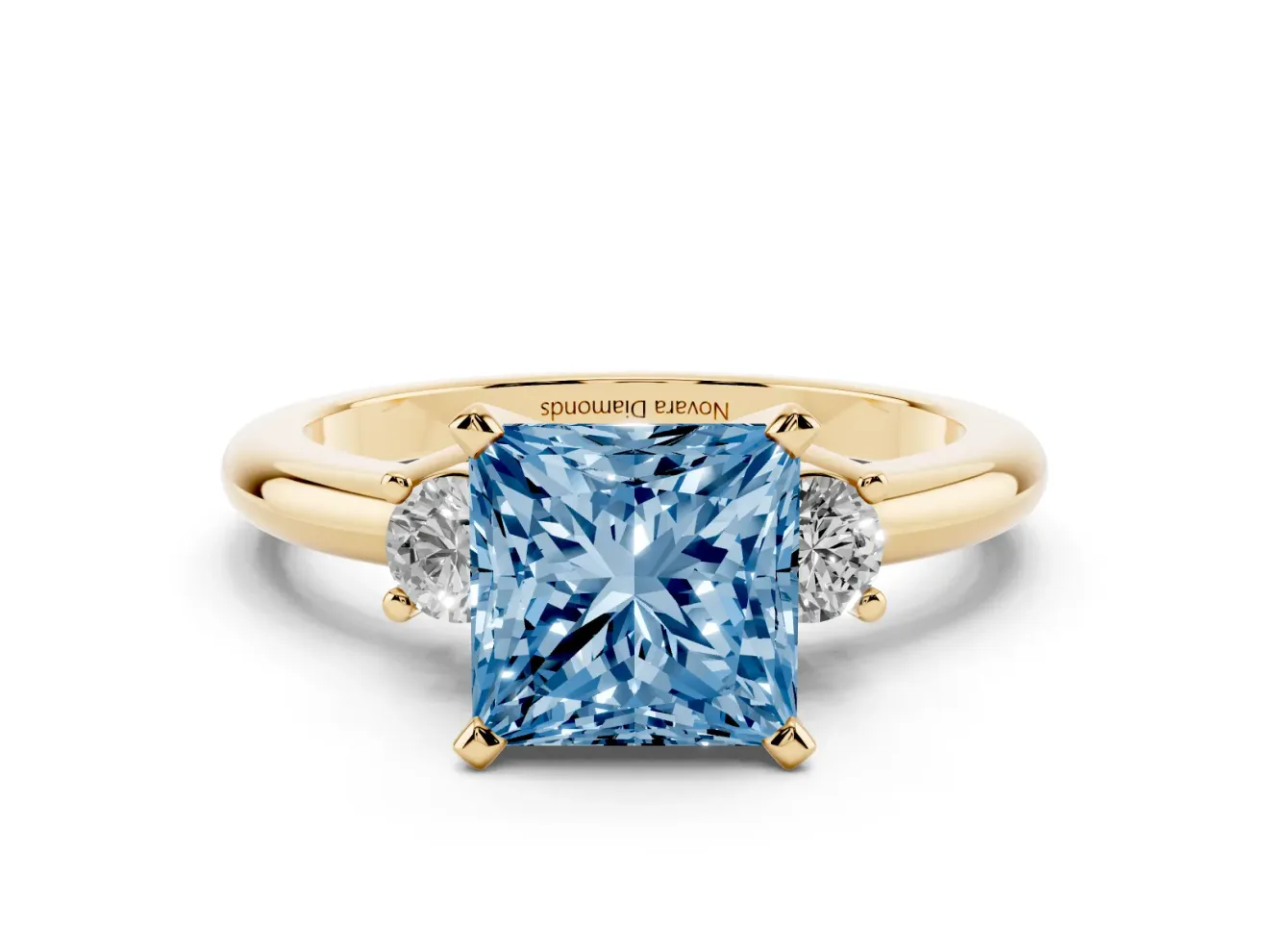 Fancy Blue Three-Stone Princess Cut Diamond Ring Set in Yellow gold with Prong Setting and Plain Band