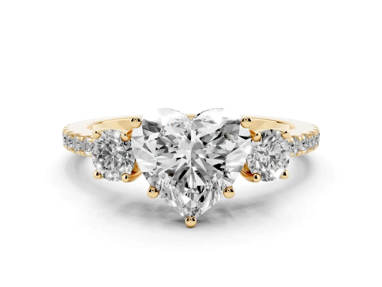 Heart Cut Diamond Three-Stone Ring Set in Yellow gold with Pavé Band and Graduated Sides