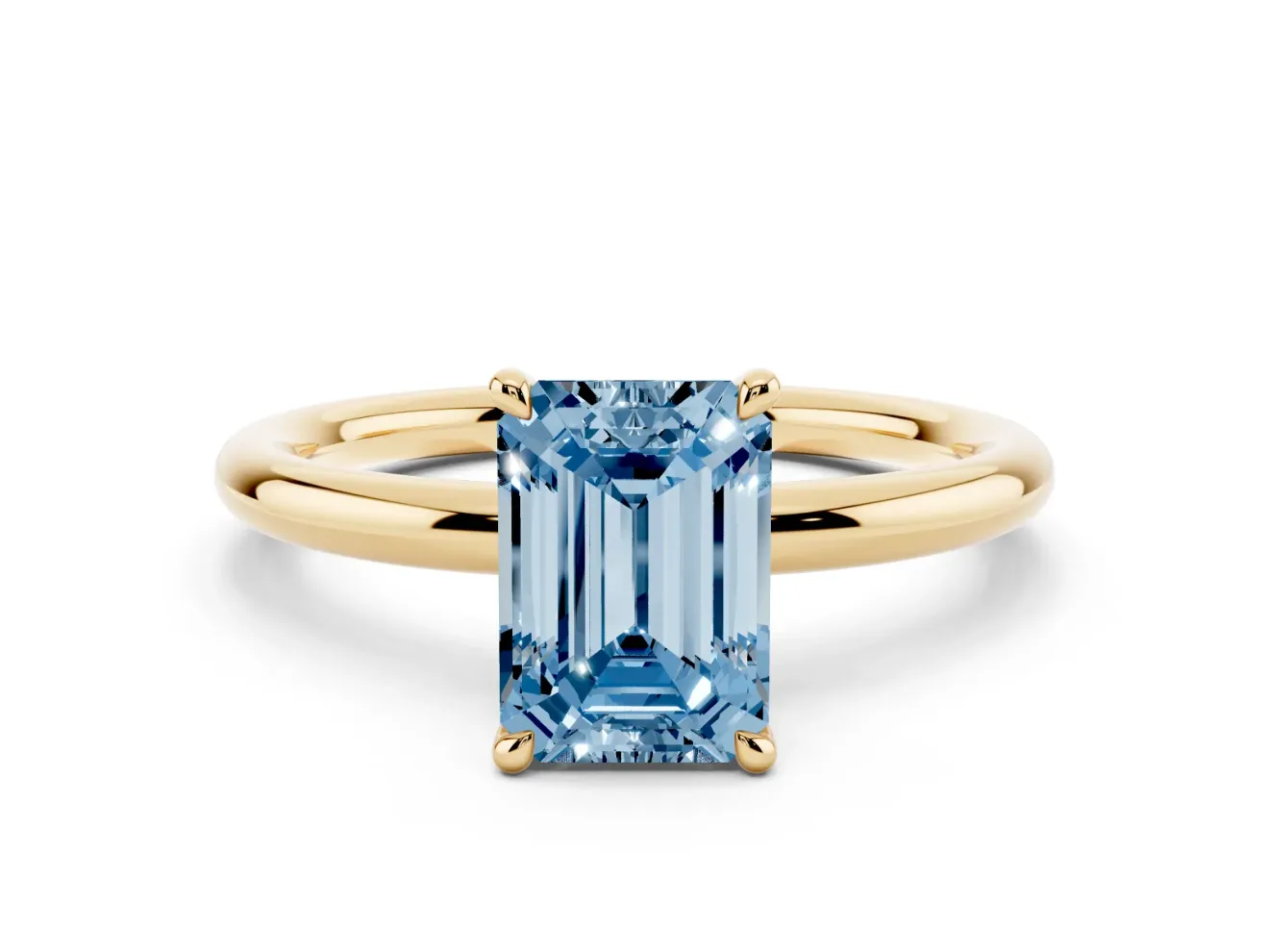 Fancy Blue Emerald Cut Diamond Solitaire Ring Set in Yellow gold with Thin Band and Prong Setting