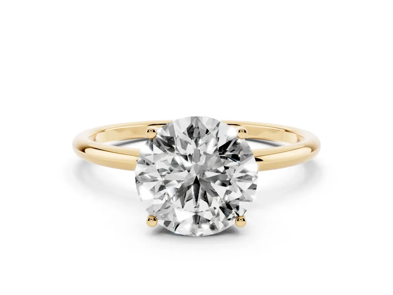 Round Cut Diamond Solitaire Engagement Ring Set in Yellow gold with Thin Band and Prong Setting