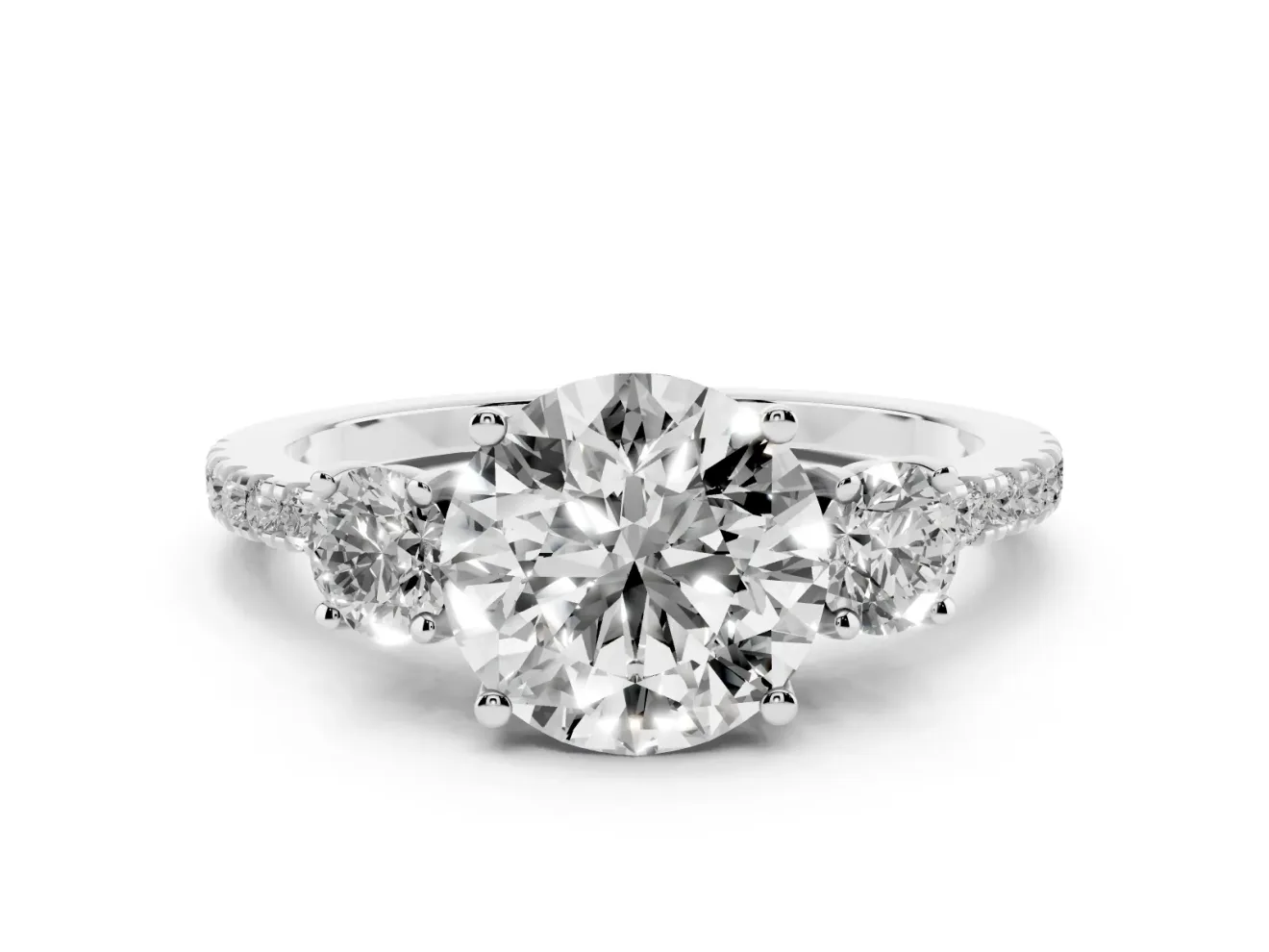 Round Cut Diamond Three-Stone Ring Set in Platinum with Pavé Band and Graduated Sides