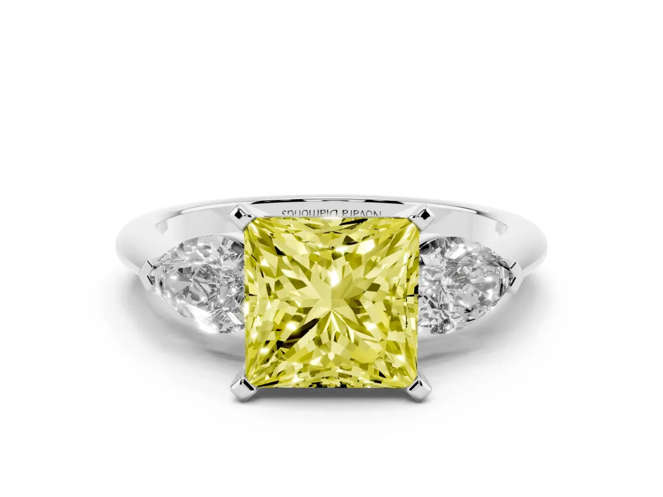 Fancy Yellow Three-Stone Princess Cut Diamond Ring Set in White gold with Pear Side Stones and Prong Setting