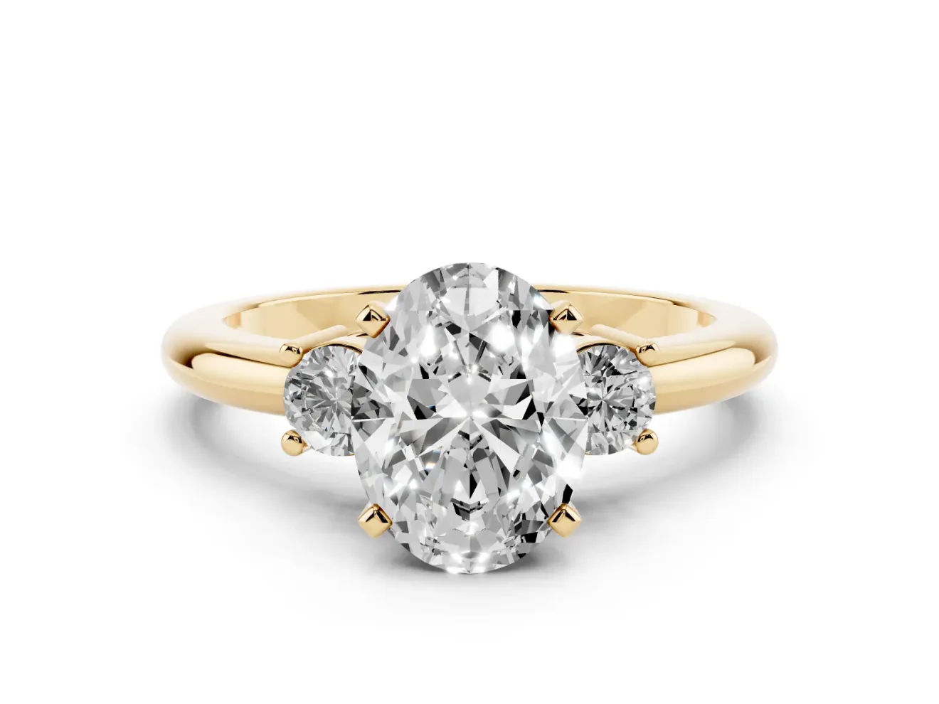 Three-Stone Oval Cut Diamond Ring Set in Yellow gold with Prong Setting and Plain Band