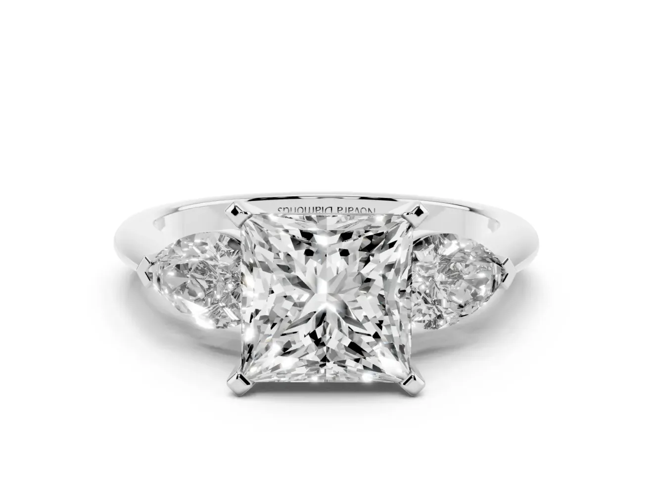 Three-Stone Princess Cut Diamond Ring Set in Platinum with Pear Side Stones and Prong Setting