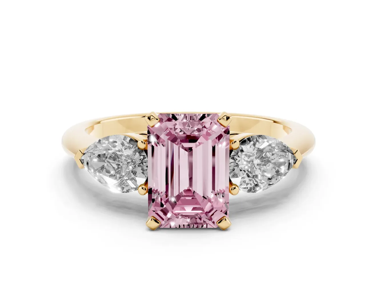 Fancy Pink Three-Stone Emerald Cut Diamond Ring Set in Yellow gold with Pear Side Stones and Prong Setting