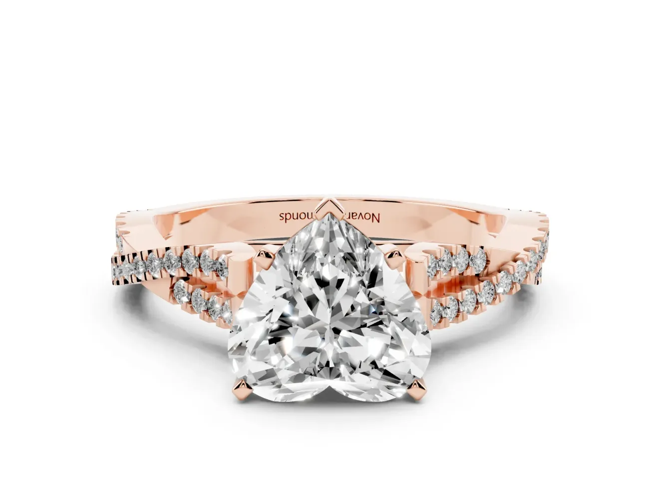 Heart Cut Diamond Solitaire Engagement Ring Set in Rose gold with Twisted Pavé Band and Prong Setting