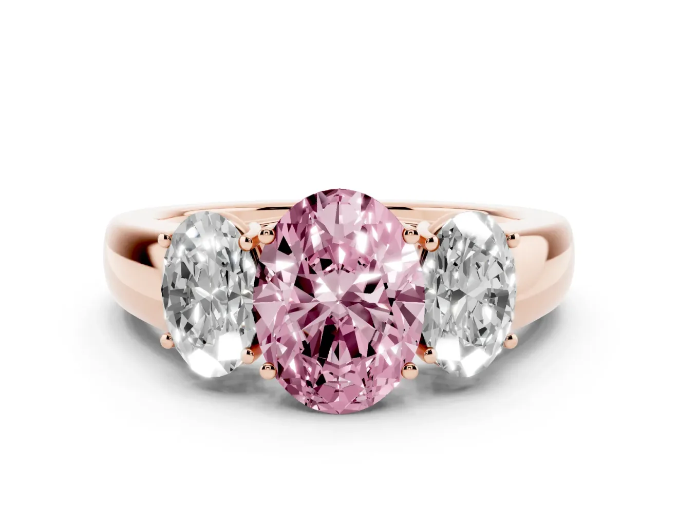Fancy Pink Three-Stone Oval Cut Diamond Ring Set in Rose gold with Matching Prong Settings and Plain Band