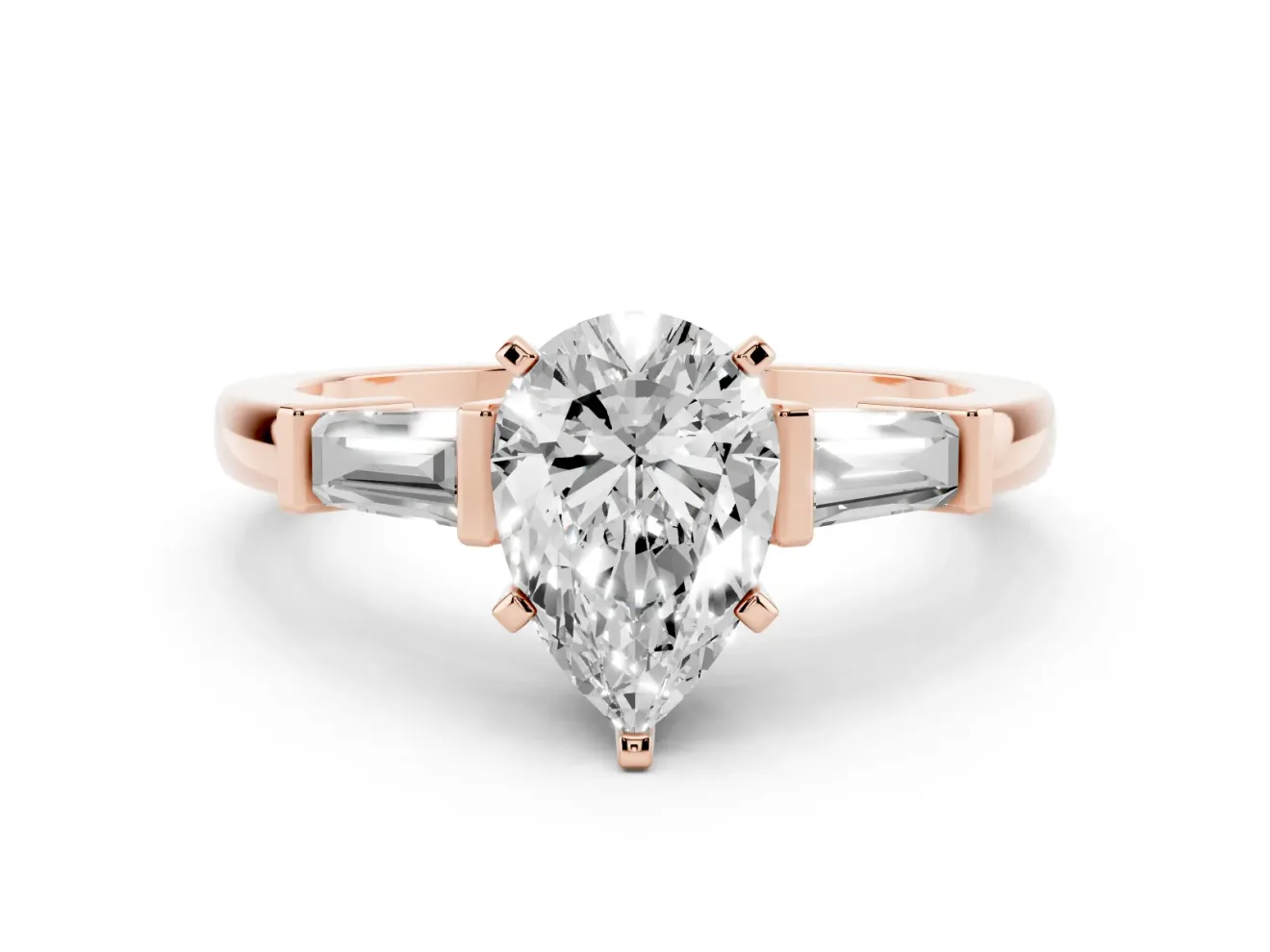 Pear Cut Diamond Solitaire Ring Set in Rose gold with Tapered Baguette Accents and Prong Setting