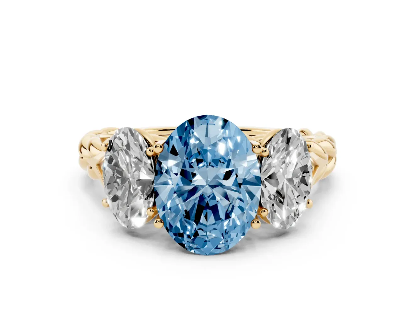 Fancy Blue Oval Cut Diamond Three-Stone Ring Set in Yellow gold with Braided Band