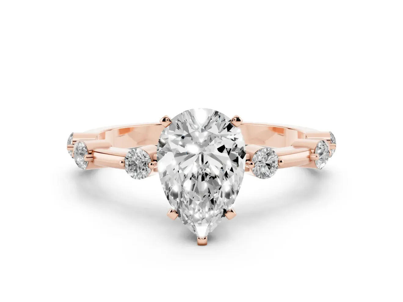 Pear Cut Diamond Solitaire Ring Set in Rose gold with Bezel Set Side Stones and Prong Setting