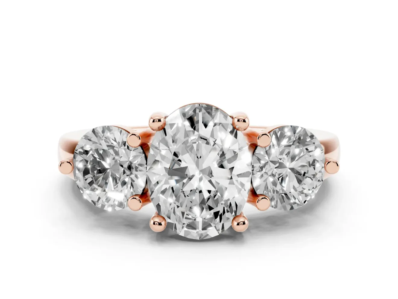 Oval Cut Diamond Three-Stone Ring Set in Rose gold with Prong Setting and Classic Band