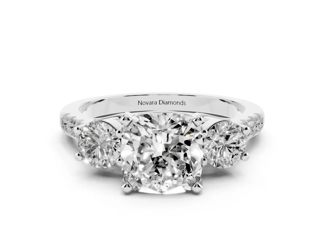 Three-Stone Cushion Cut Diamond Pavé Band Ring Set in White gold with Prong-Set Trio