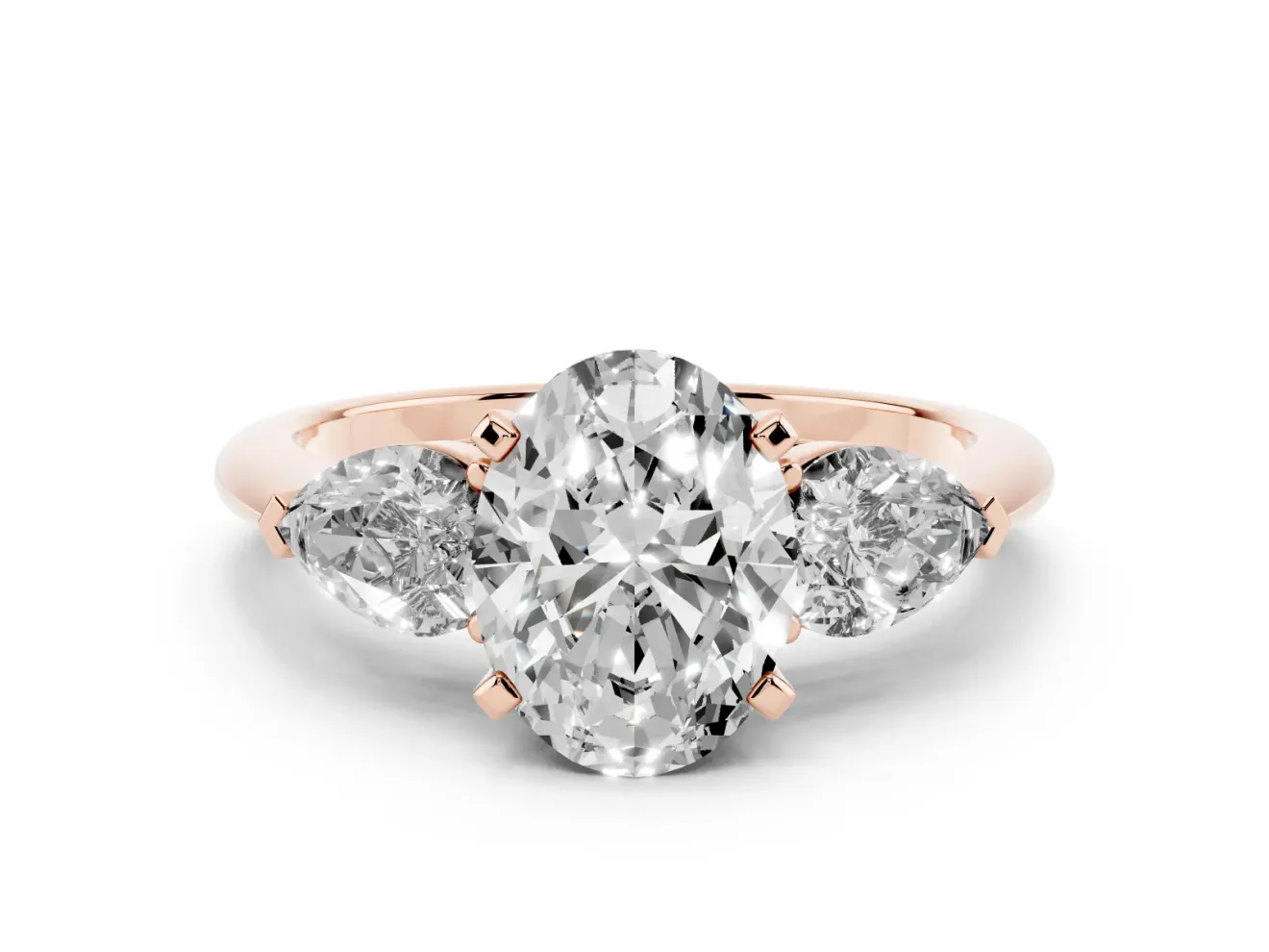 Three-Stone Oval Cut Diamond Ring Set in Rose gold with Pear Side Stones and Prong Setting