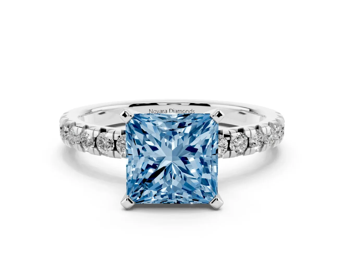 Fancy Blue Princess Cut Diamond Solitaire Pavé Engagement Ring Set in White gold with Round Band and Prong Setting