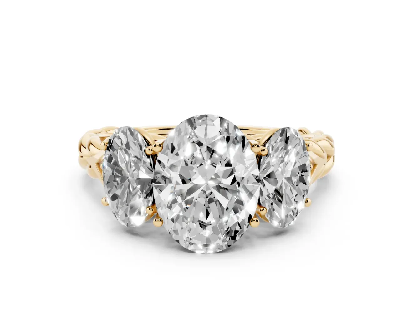 Oval Cut Diamond Three-Stone Ring Set in Yellow gold with Braided Band