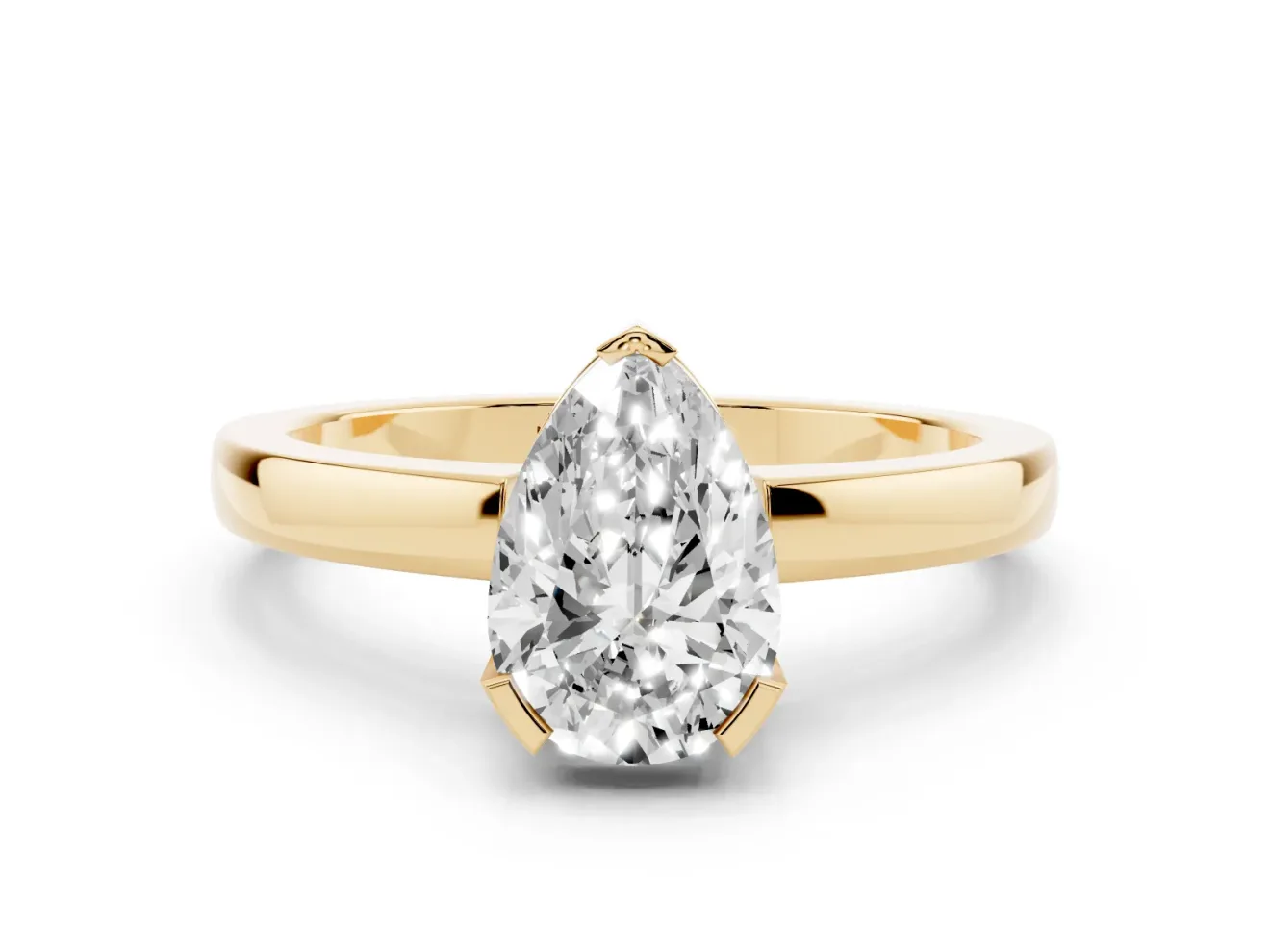 Pear Cut Diamond Solitaire Ring Set in Yellow gold with Prong Head and Smooth Polished Band