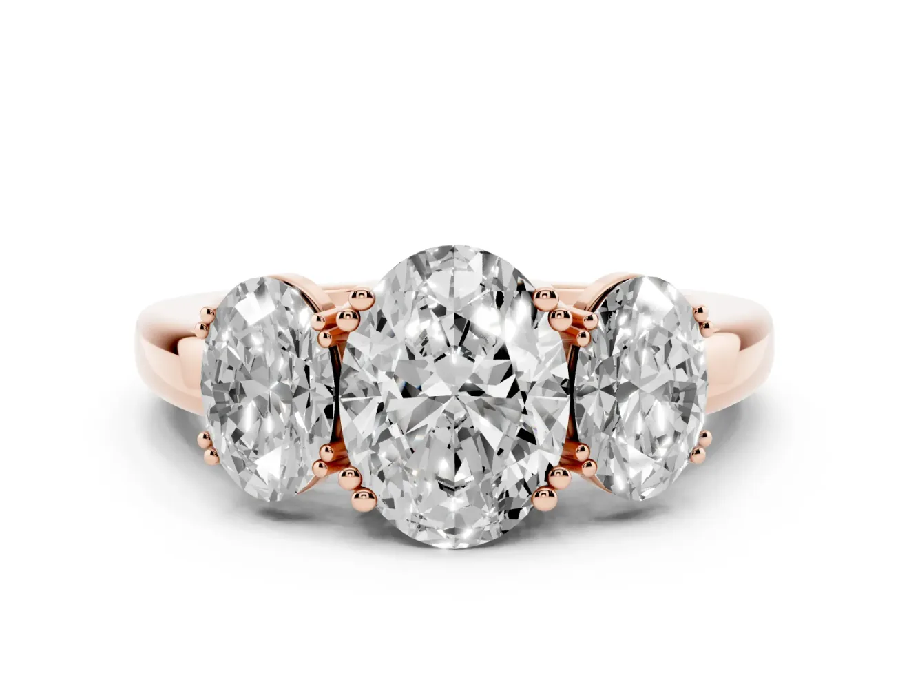 Oval Cut Diamond Three-Stone Ring Set in Rose gold with Polished Band and Prong Setting
