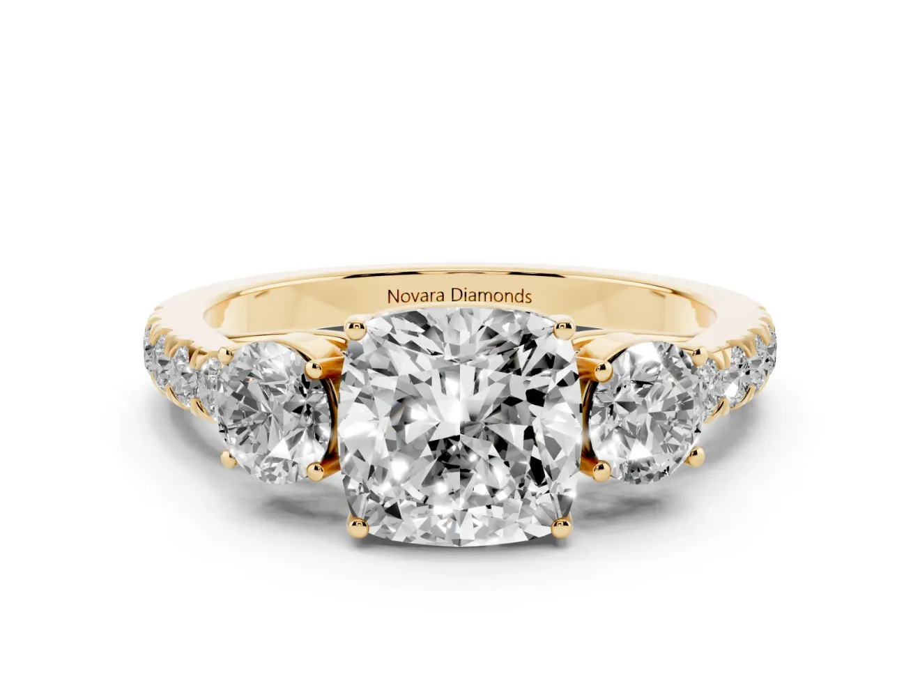 Cushion Cut Diamond Three-Stone Ring Set in Yellow gold with Round Side Stones and Delicate Pavé Band