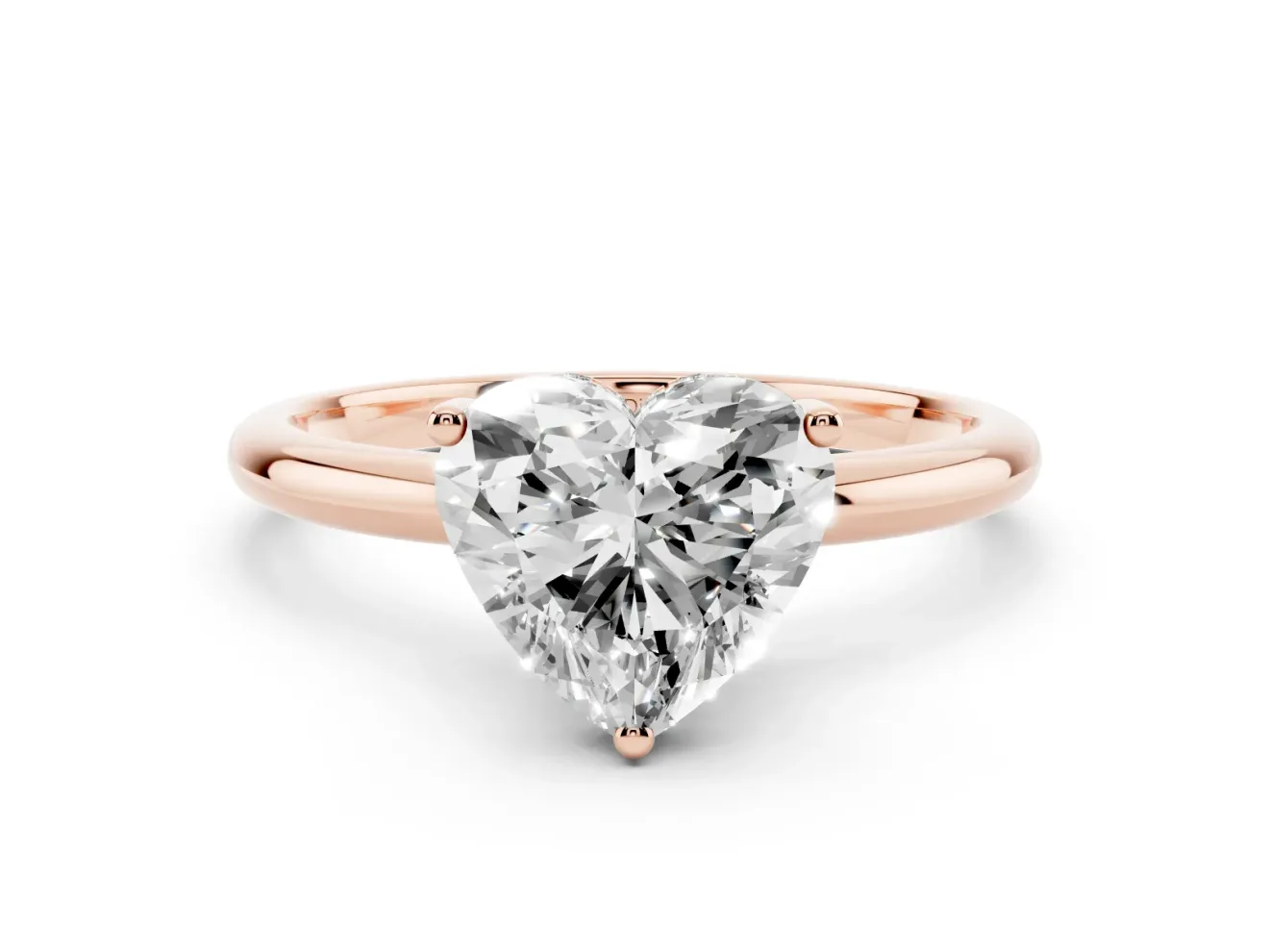 Heart Cut Diamond Solitaire Engagement Ring Set in Rose gold with Prong Setting and Polished Band