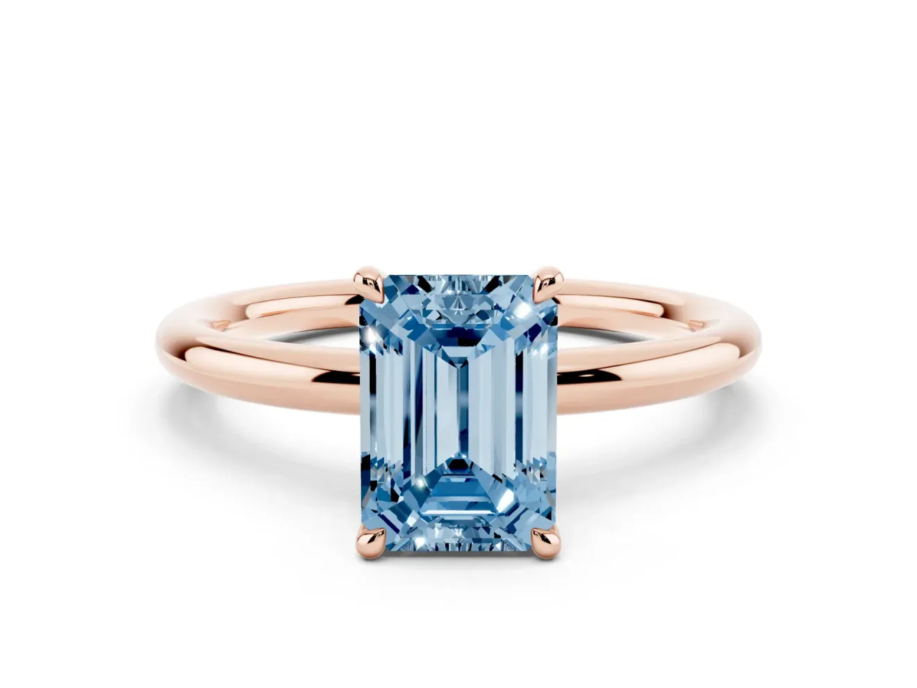 Fancy Blue Emerald Cut Diamond Solitaire Ring Set in Rose gold with Thin Band and Prong Setting