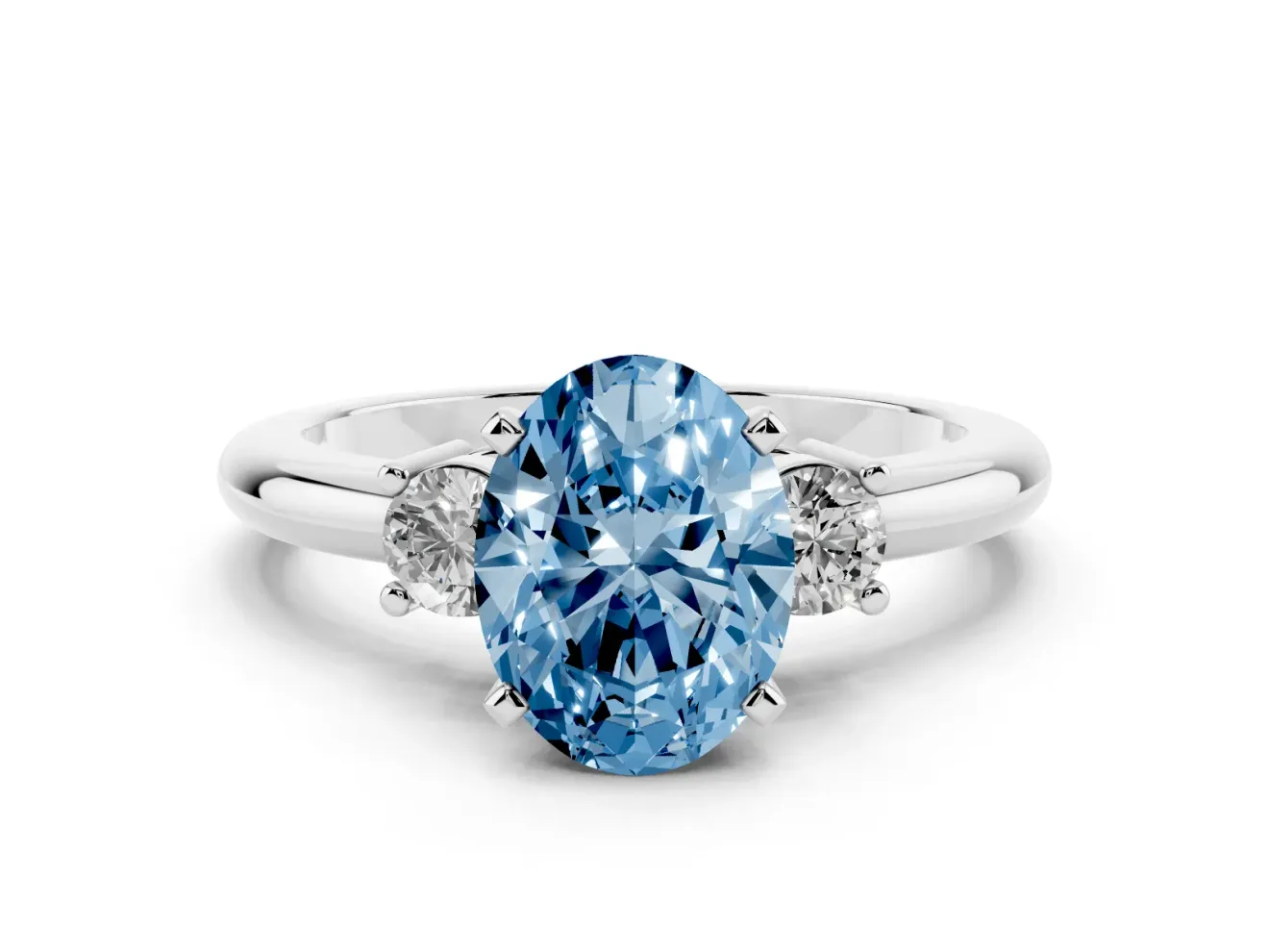 Fancy Blue Three-Stone Oval Cut Diamond Ring Set in Silver with Prong Setting and Plain Band