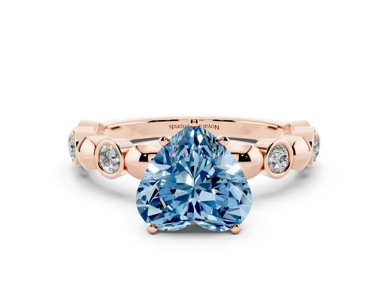 Fancy Blue Heart Cut Diamond Solitaire Ring Set in Rose gold with Bezel-Set Accents on Beaded Band and Prong Setting