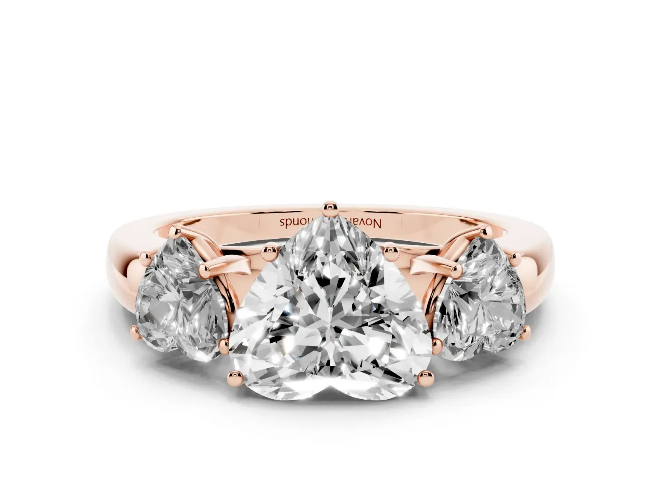 Heart Cut Diamond Three-Stone Ring Set in Rose gold with Bold Center and Classic Band