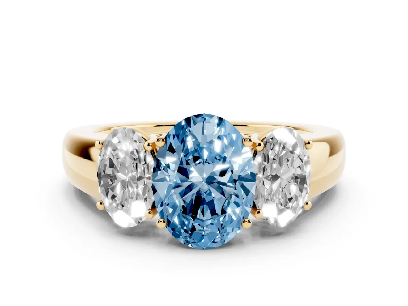 Fancy Blue Three-Stone Oval Cut Diamond Ring Set in Yellow gold with Matching Prong Settings and Plain Band
