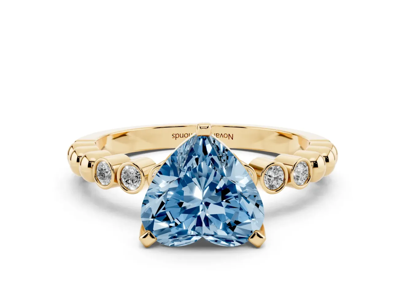 Fancy Blue Heart Cut Diamond Solitaire Engagement Ring Set in Yellow gold with Bezel Accents on Beaded Band