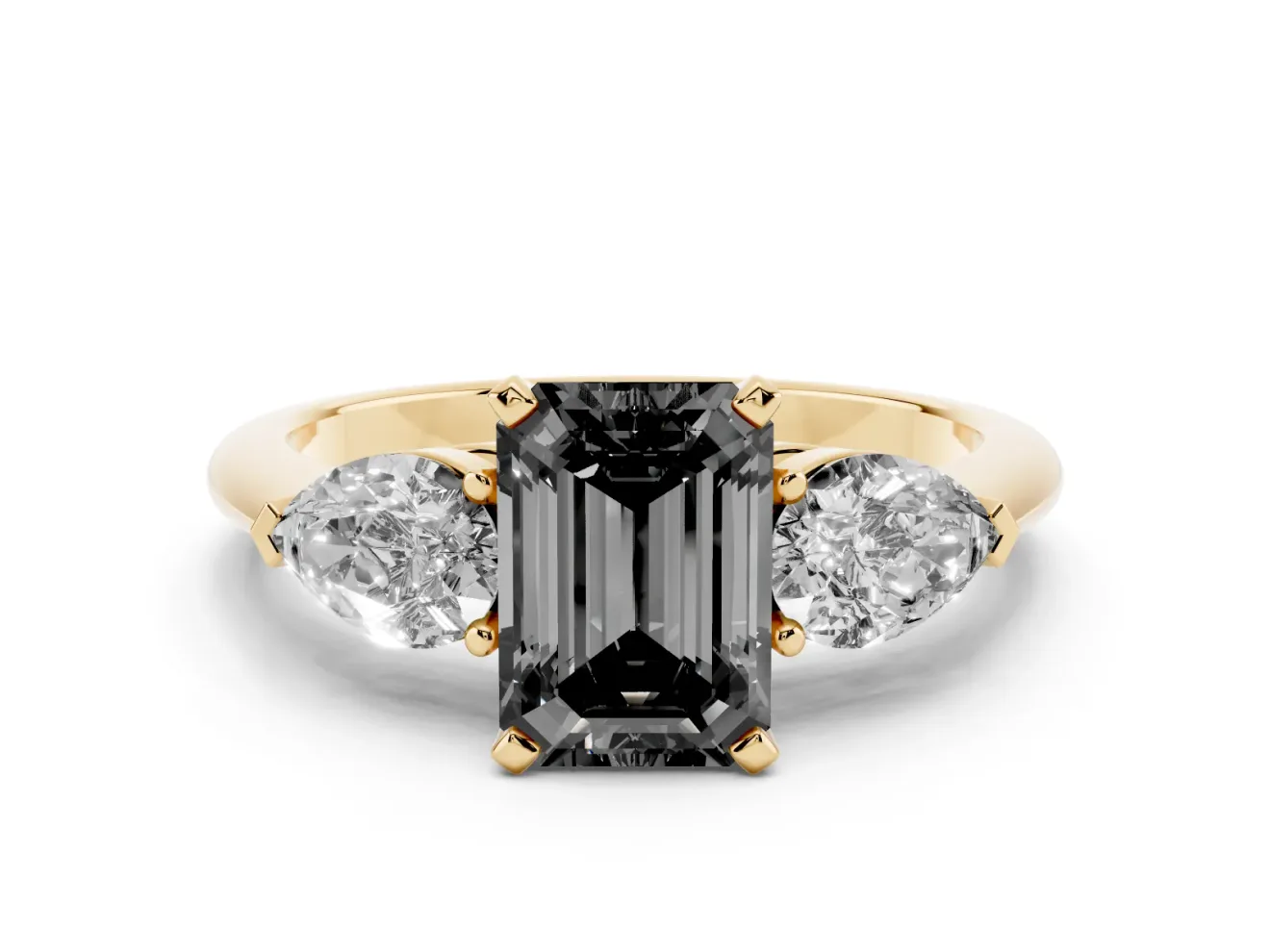 Fancy Black Three-Stone Emerald Cut Diamond Ring Set in Yellow gold with Pear Side Stones and Prong Setting