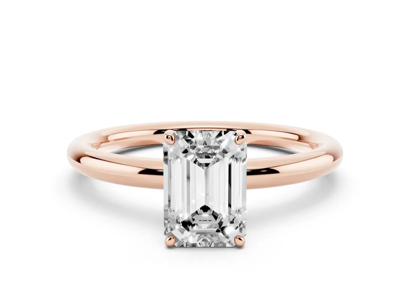 Emerald Cut Diamond Solitaire Ring Set in Rose gold with Prong Setting on a Polished Plain Band