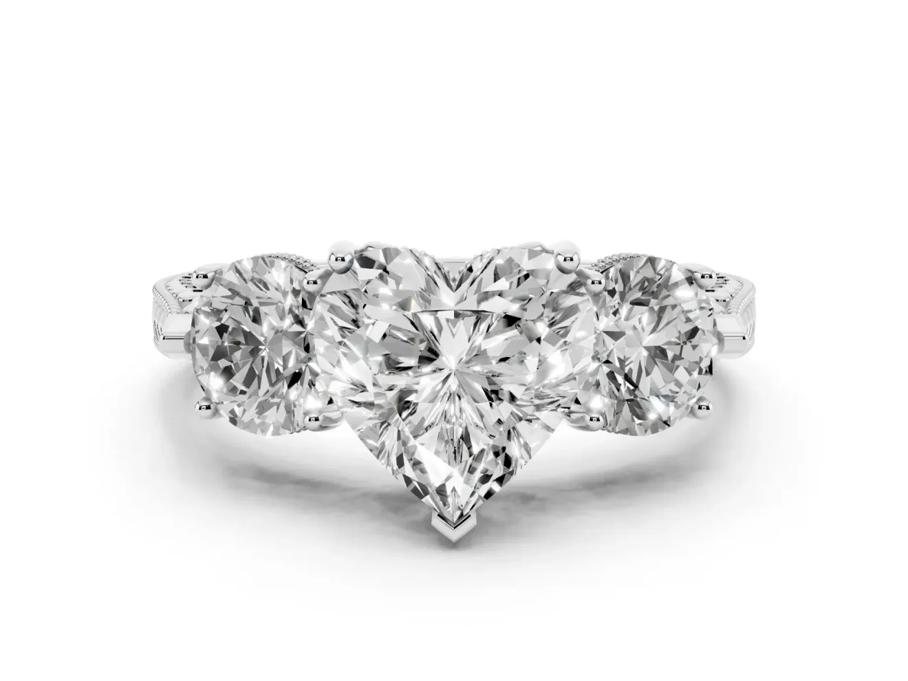 Heart Cut Diamond Three-Stone Ring Set in White gold with Milgrain Band