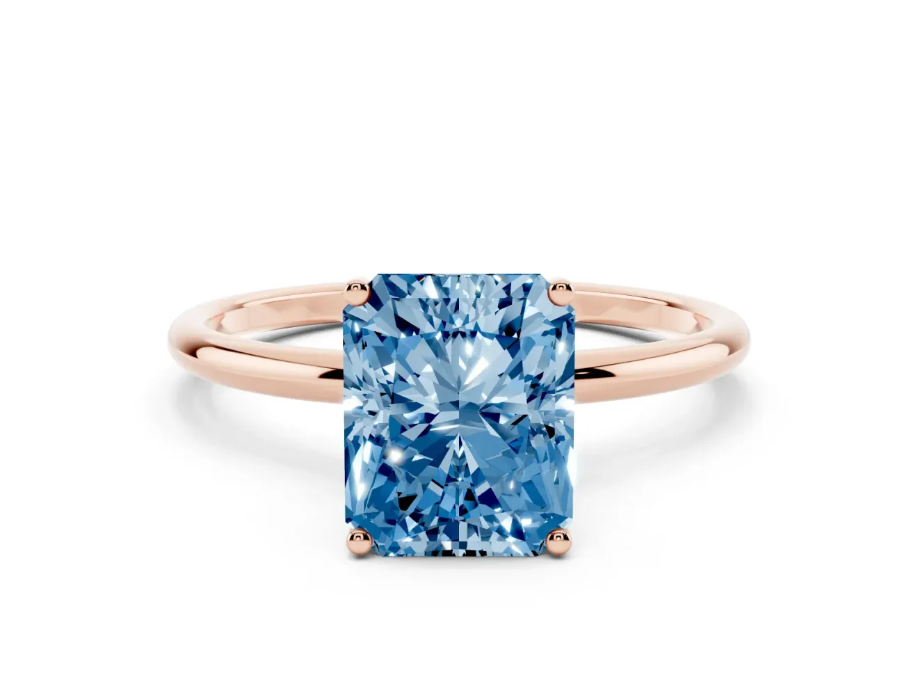 Fancy Blue Radiant Cut Diamond Solitaire Engagement Ring Set in Rose gold with Thin Band and Prong Setting