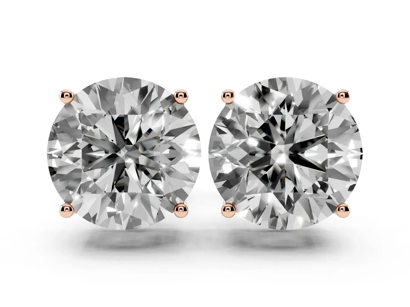 Round Cut Diamond Solitaire Stud Earrings Set in Rose gold with Basket Setting