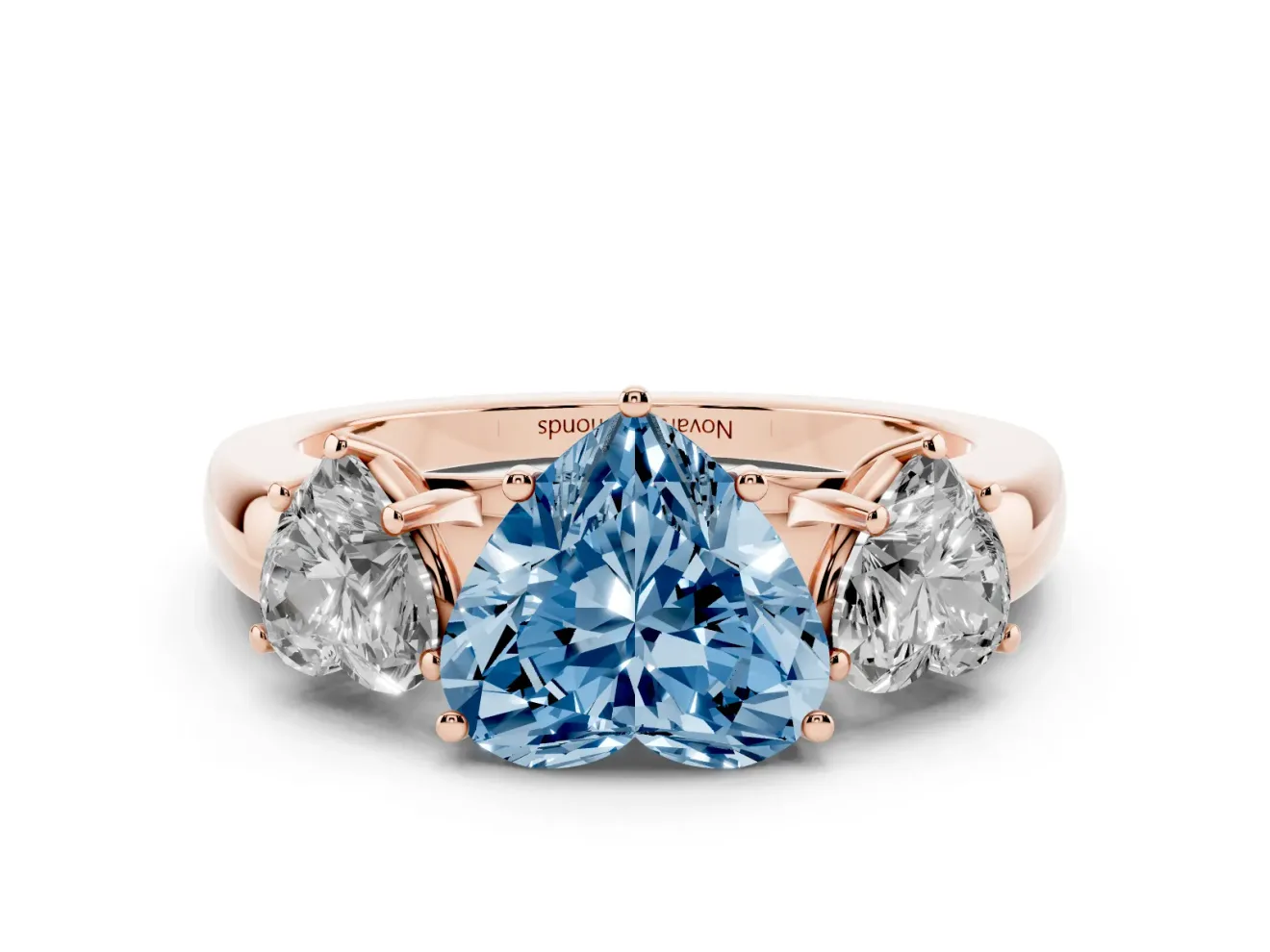 Fancy Blue Heart Cut Diamond Three-Stone Ring Set in Rose gold with Bold Center and Classic Band