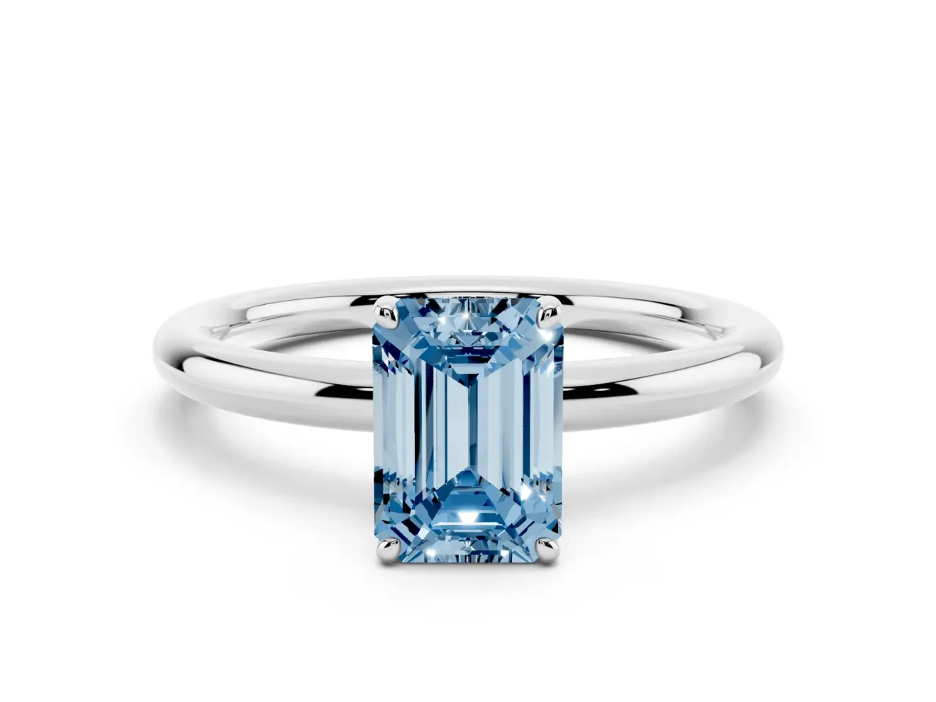 Fancy Blue Emerald Cut Diamond Solitaire Ring Set in White gold with Prong Setting on a Polished Plain Band